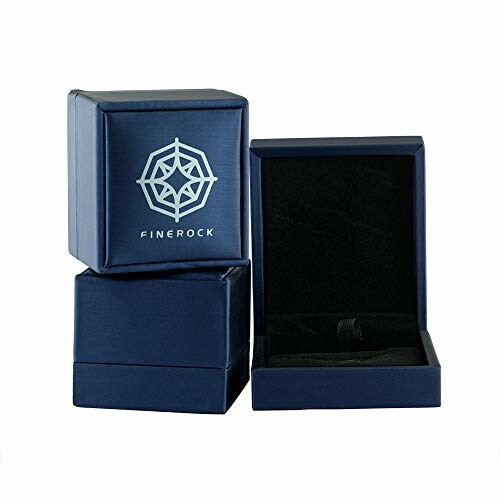Three blue jewelry boxes, one open with black interior.