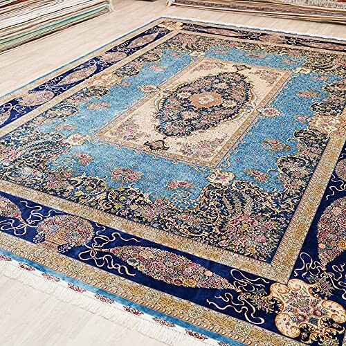 Intricate blue and floral patterned rug with ornate design