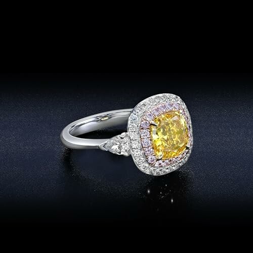 Elegant yellow diamond engagement ring with halo setting.