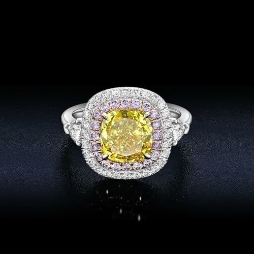 Elegant ring with a yellow diamond surrounded by smaller stones